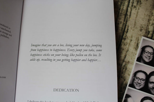 Close-up of the book’s textured cover featuring embossed title and vibrant yellow-orange background with subtle leaf patterns