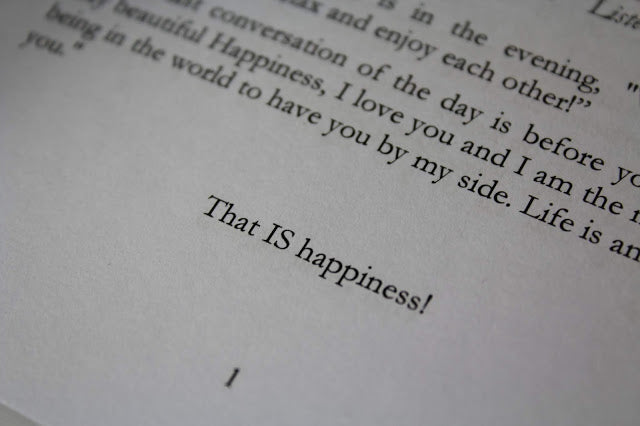 Close-up of the book’s textured cover featuring embossed title and vibrant yellow and white design elements on a white