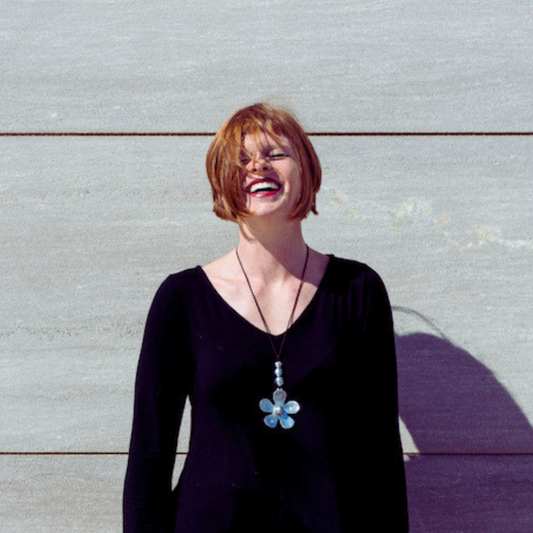 Jacqueline Pirtle laughing in natural light — Energetic First Look Session, your first live energy reading for women ready to feel aligned and happy.